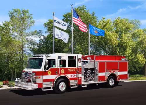 Pierce Dash pumper driver-side profile showing pump panel controls and body compartments